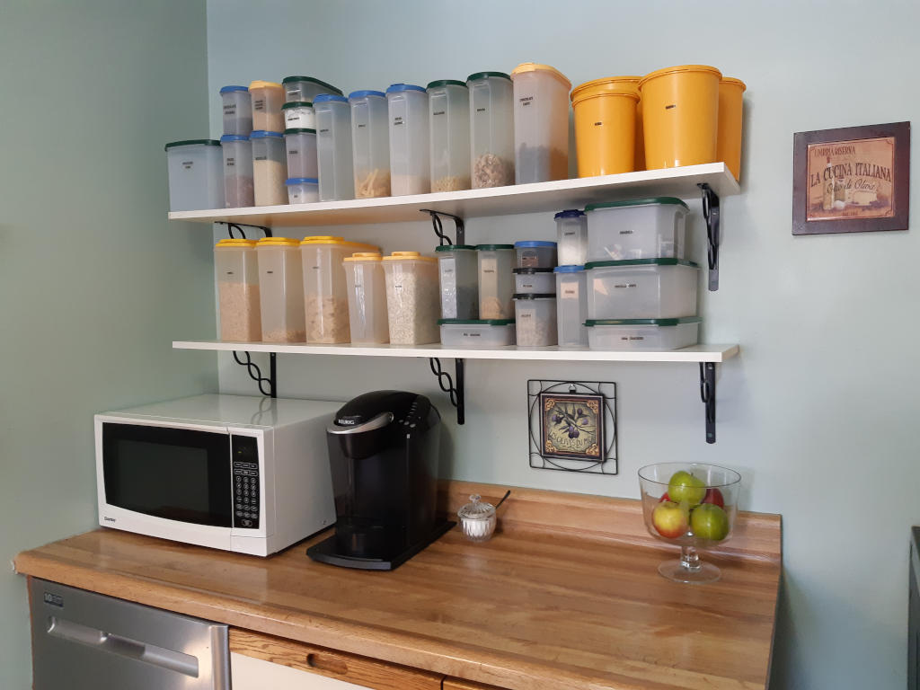 Organized kitchen shelves and counter